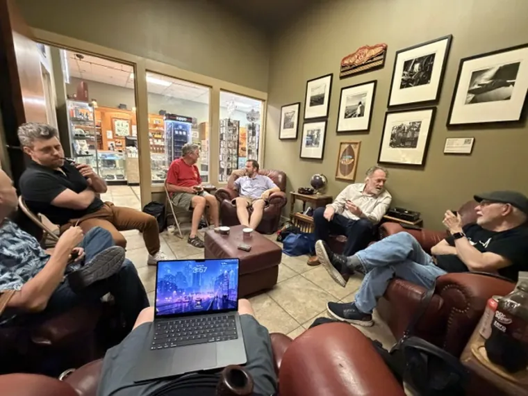 Members relaxing on lounge sofas